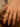 Close-up of a woman's finger showcasing Bezel Set Open Ring Set