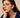 Close-up of a woman's neck showcasingBlackOnyxHuggieHoopEarrings