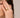 Close-up of a woman's finger showcasing Double Hoop Pearl Stacking Ring