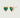 A pair of heart-shaped stud earrings with lab-grown emerald gemstones set within the hearts