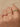Close-up of a woman's finger showcasing Half Pavé Ring Set