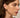 Close-up of a woman's neck showcasing LapisLazuliHuggieHoopEarrings