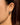 Close-up of a woman's neck showcasing MoissaniteOverlappedSilverTriangleEarrings