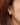 Close-up of a woman's neck showcasingMoissanite Teardrop Hoop Earrings