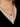 Close-up of a woman's neck showcasing MoonstoneSignatureCharmNecklace