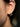 Close-up of a woman's ear showcasing PearlArcEarrings