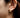 Close-up of a woman's ear showcasing Pearl Dainty Hoop Earrings