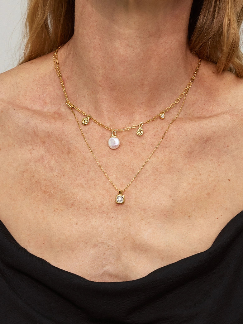 Close-up of a woman's neck showcasing Asscher Diamond Charm Necklace