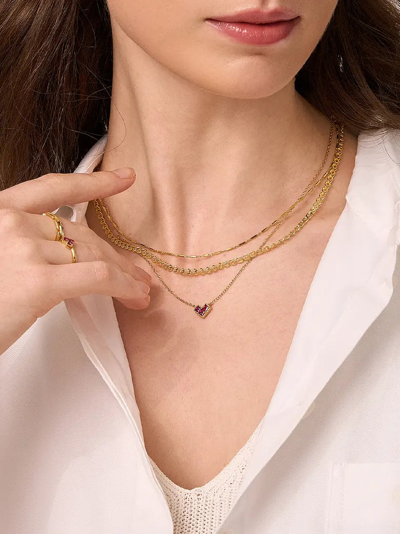 Close-up of a woman's neck showcasing BarLinkChainNecklace