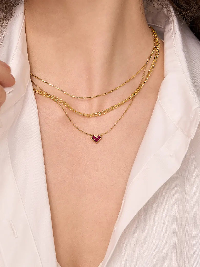 Close-up of a woman's neck showcasing BarLinkChainNecklace