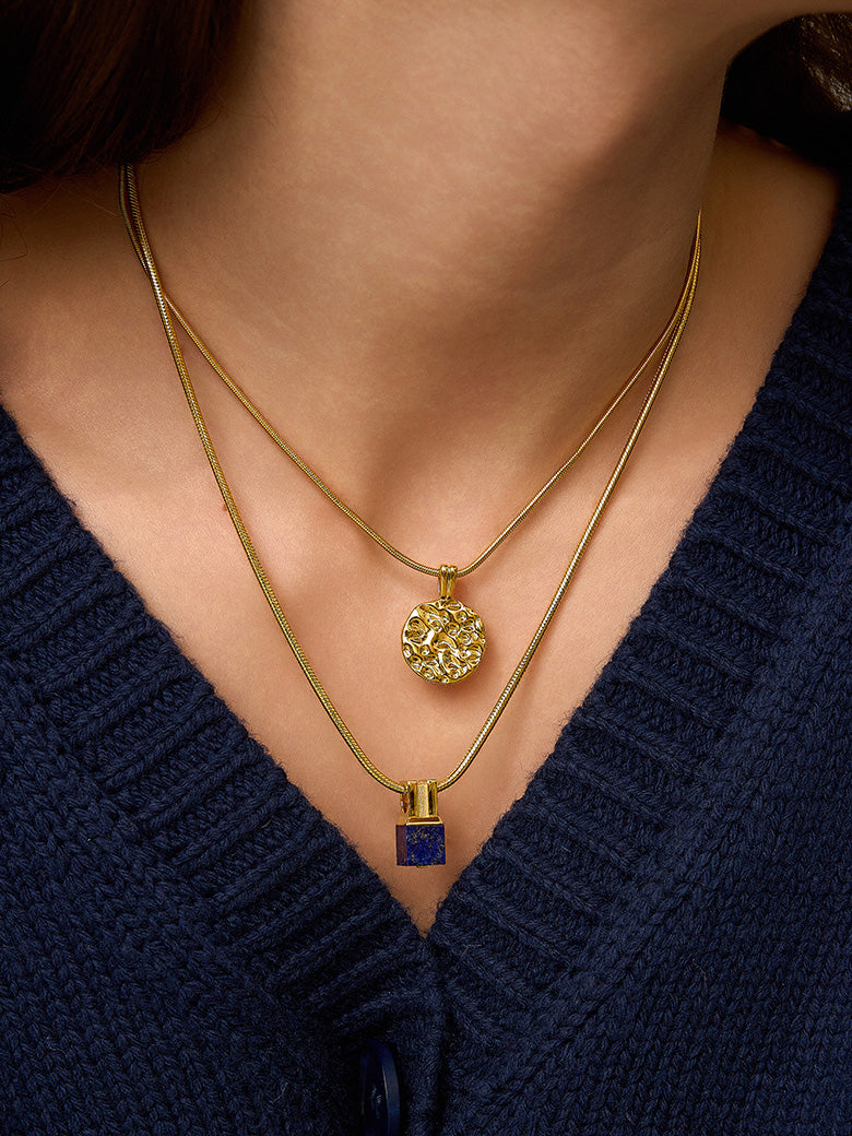 Close-up of a woman's neck showcasing BespokeCoinNecklace