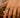 Close-up of a woman's finger showcasing Bezel Set Open Ring Set