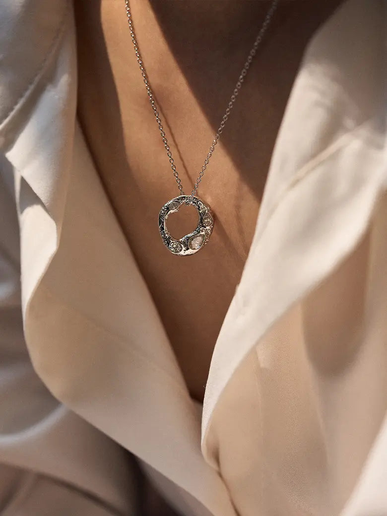Close-up of a woman's neck showcasing CelestialHaloSilverNecklace