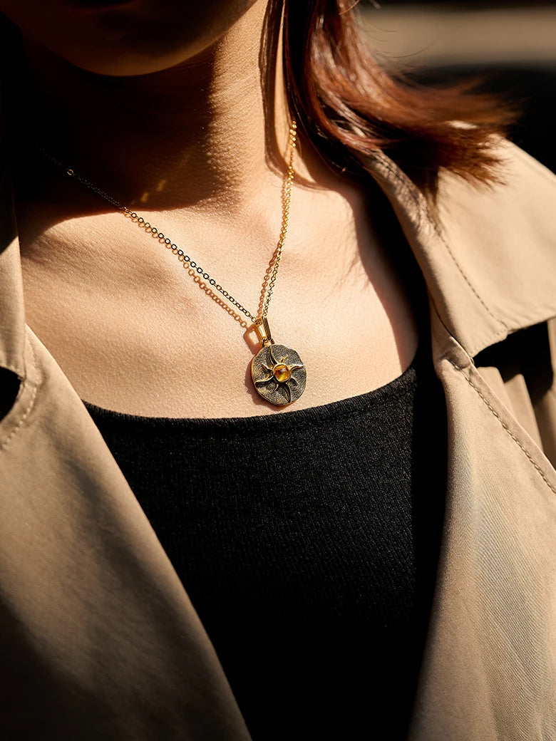 Close-up of a woman's neck showcasing CitrineSunCoinPendant
