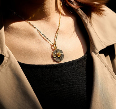 Close-up of a woman's neck showcasing CitrineSunCoinPendant
