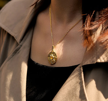 Close-up of a woman's neck showcasing CitrineSunCoinPendant