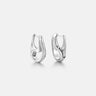 Contour Silver Hoops Earrings showcasing a minimalist sculptural design with smooth curves.