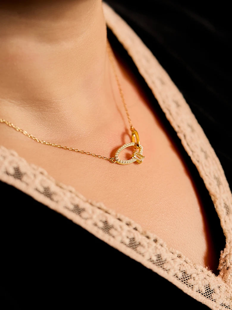 Close-up of a woman's neck showcasing CrossoverOvalGemstoneNecklace