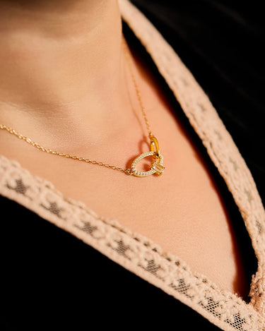 Close-up of a woman's neck showcasing CrossoverOvalGemstoneNecklace