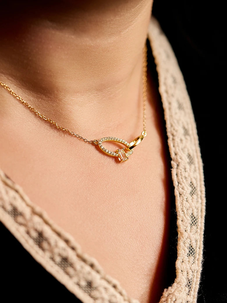 Close-up of a woman's neck showcasing CrossoverOvalGemstoneNecklace