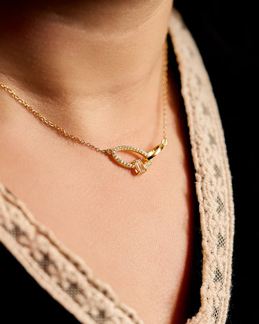 Close-up of a woman's neck showcasing CrossoverOvalGemstoneNecklace
