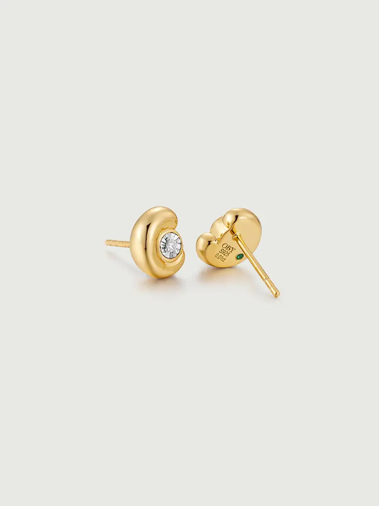 Diamond Arc Stud Earrings showcasing lab-grown diamonds in a sleek gold arc design.