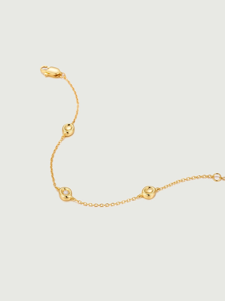 Diamond Bezel Dot Bracelet featuring gold chain and circular bezels for a minimalist look.