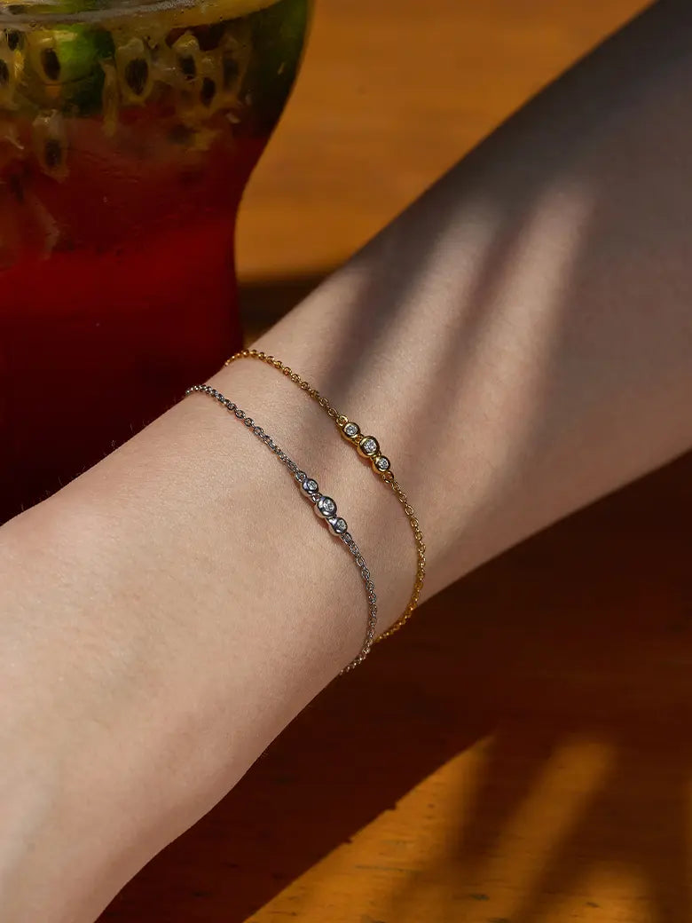 Close-up of a woman's wrist showcasing DiamondSpheresSilverBracelet 