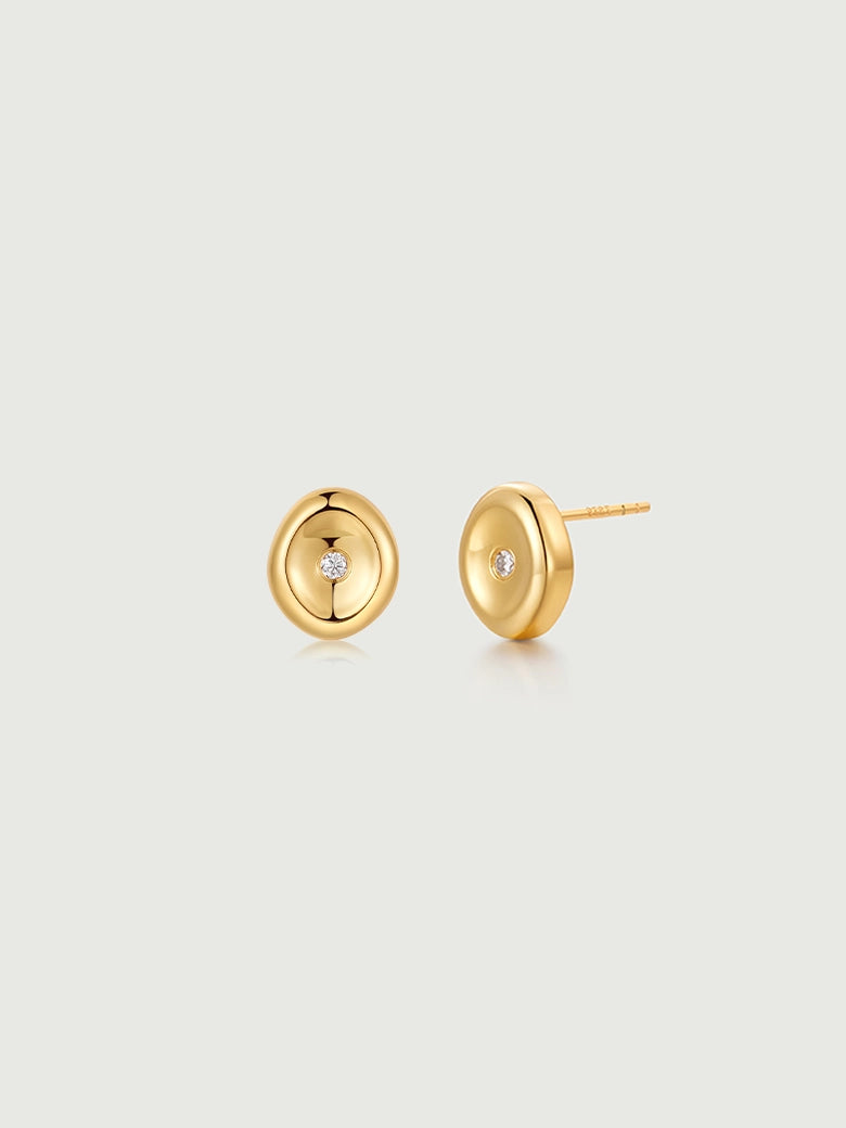 Elegant diamond wax seal studs featuring a gold finish and a central diamond for a subtle minimalist look.