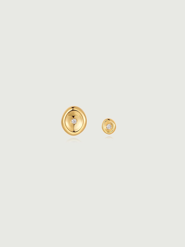 Diamond Wax Seal Studs showcasing a minimalist design with elegant gold discs and sparkling diamond centers.