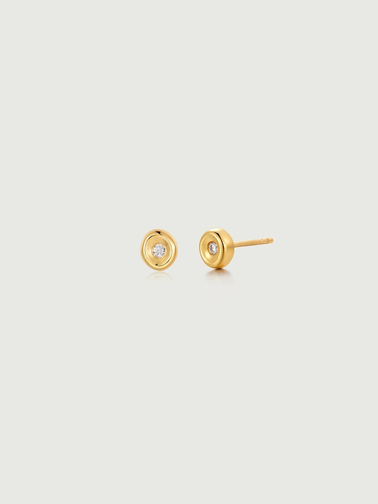 Diamond Wax Seal Studs featuring a gold disc design and a central brilliant accent for minimalist elegance.
