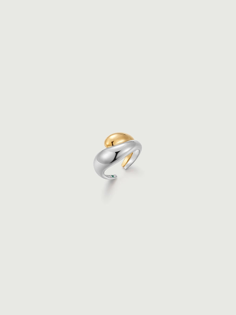 Duo Dome Ring showcasing intertwined silver and gold bands in a minimalist sculptural design.
