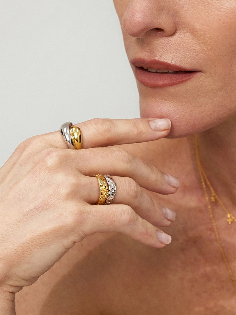 Model showcasing the Duo Dome Ring and other elegant rings on her fingers.