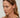 Close-up of a model wearing Duo Link Hoop Earrings, showcasing their two-tone and detachable design.