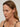 Close-up of a model wearing Duo Link Hoop Earrings, showcasing their two-tone and detachable design.