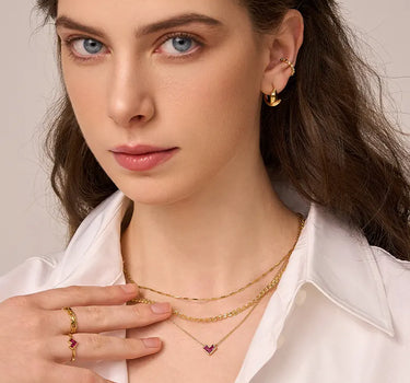 Close-up of a woman's neck showcasing EternalLoopGoldChainNecklace