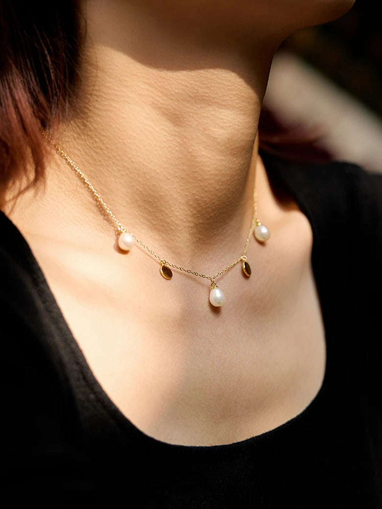 Close-up of a woman's neck showcasing FloatingPearlNecklace