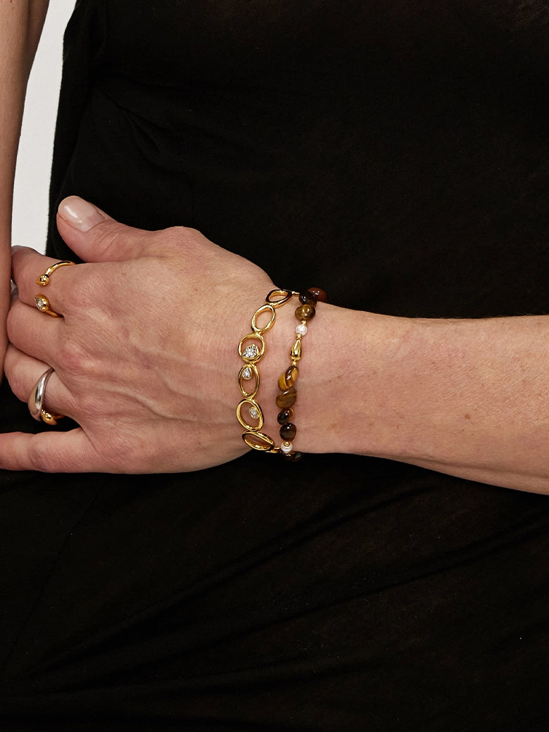 Close-up of a woman's wrist showcasing Golden Tiger's Eye Beaded Bracelet