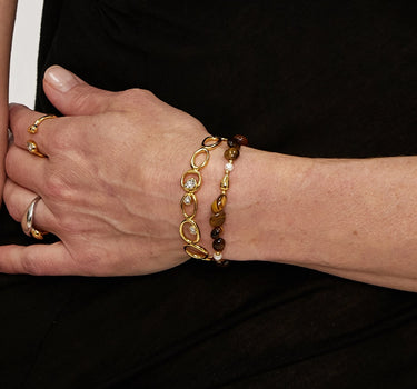 Close-up of a woman's wrist showcasing Golden Tiger's Eye Beaded Bracelet