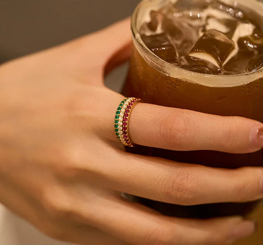 Close-up of a woman's finger showcasing Half Pavé Ring Set