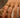 Close-up of a woman's finger showcasing Half Pavé Ring Set