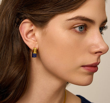 Close-up of a woman's neck showcasing LapisLazuliHuggieHoopEarrings