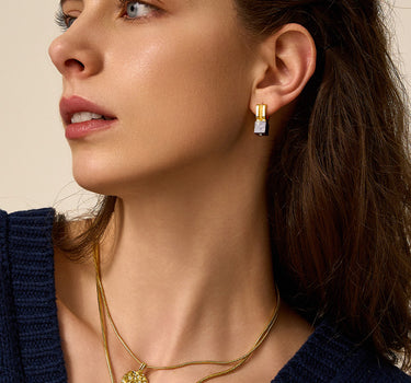Close-up of a woman's neck showcasing LapisLazuliHuggieHoopEarrings