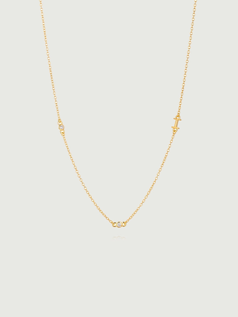 Mini Diamond Bezel Necklace featuring a delicate gold chain with bezel-set diamonds for elegant sparkle.