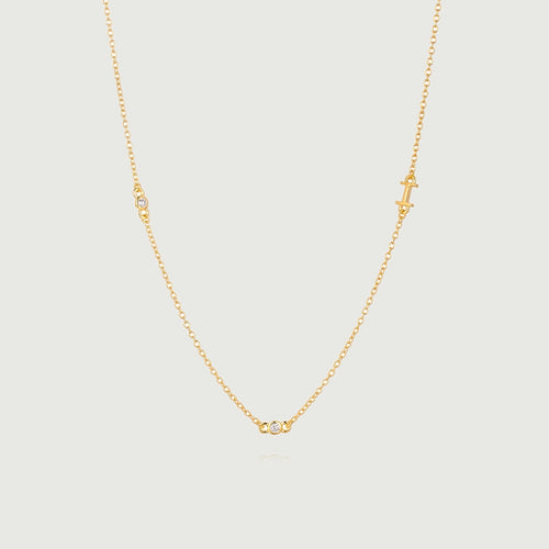 Mini Diamond Bezel Necklace featuring a delicate gold chain with bezel-set diamonds for elegant sparkle.