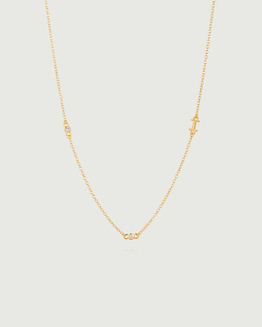 Mini Diamond Bezel Necklace featuring a delicate gold chain with bezel-set diamonds for elegant sparkle.