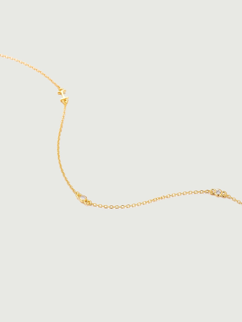 Mini Diamond Bezel Necklace featuring a delicate gold chain with bezel-set diamonds for elegance and sparkle.