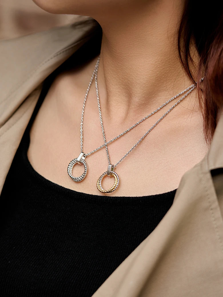 Close-up of a woman's neck showcasing Möbius Two Tone Silver Necklace