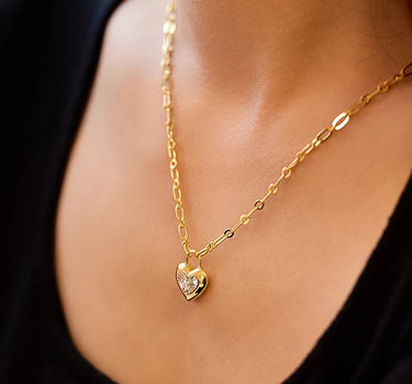 Close-up of a woman's neck showcasingMoissaniteHeartLockCharmNecklace