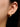 Close-up of a woman's ear showcasing MoissaniteHoopEarringswithMorganite